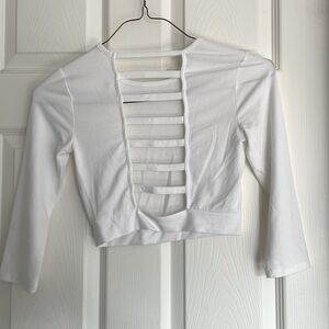 Cropped white long sleeve top with open back detail